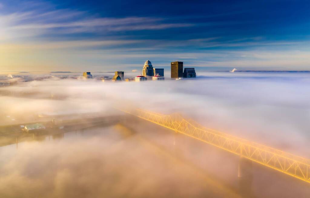 Aerial view of Louisville, Kentucky skyline at morning with a blanket of fog